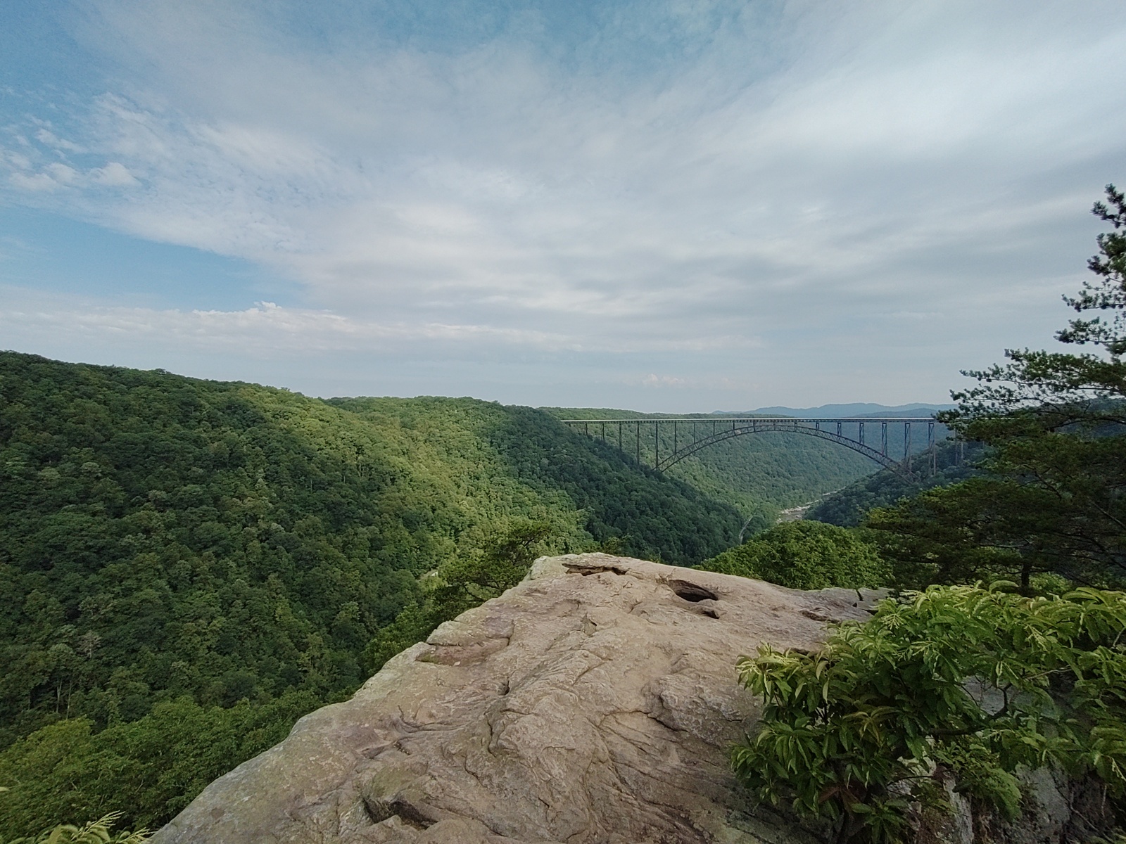 New River Gorge bridge and mountains, viewed perpendicular to the bridge.